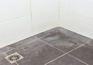 floor of a shower stained with hard water 