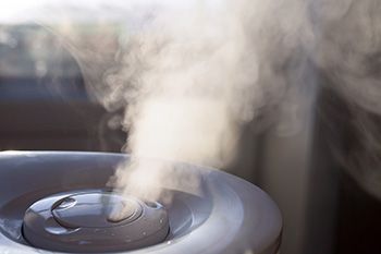 humidifier blowing steam into a room