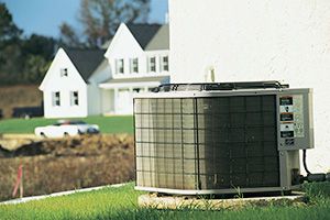 an HVAC unit outside of a house in a residential area